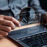 Government officials reviewing digital contract management software on laptop screen