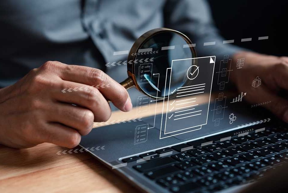 shutterstock_2261230821-compressed Government officials reviewing digital contract management software on laptop screen