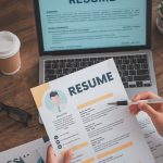 HR manager reviewing job application template analytics showing 70% candidate abandonment rate on dashboard